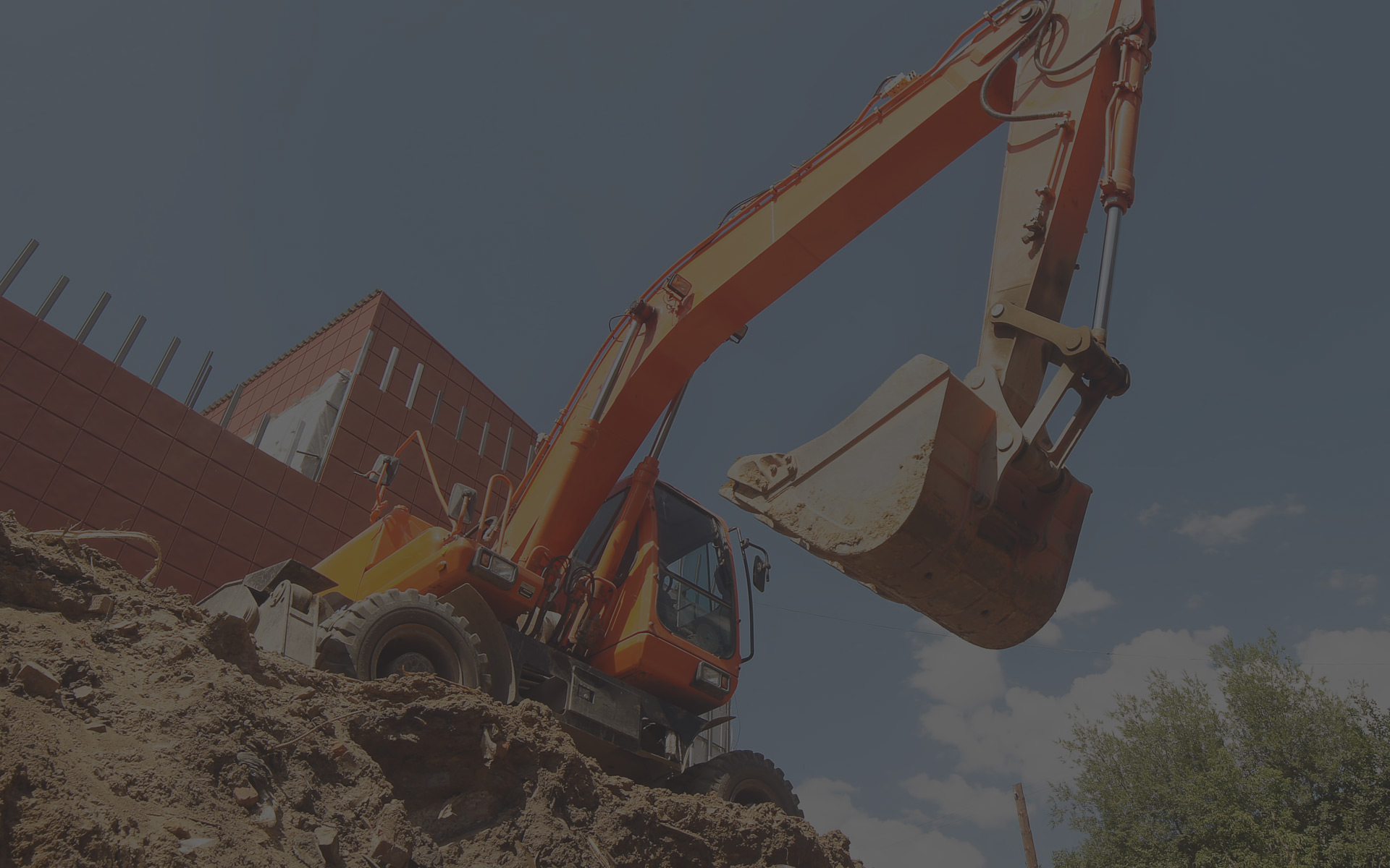 Excavator moving aggregate on a quarry site, where Dancore screens are used for sizing